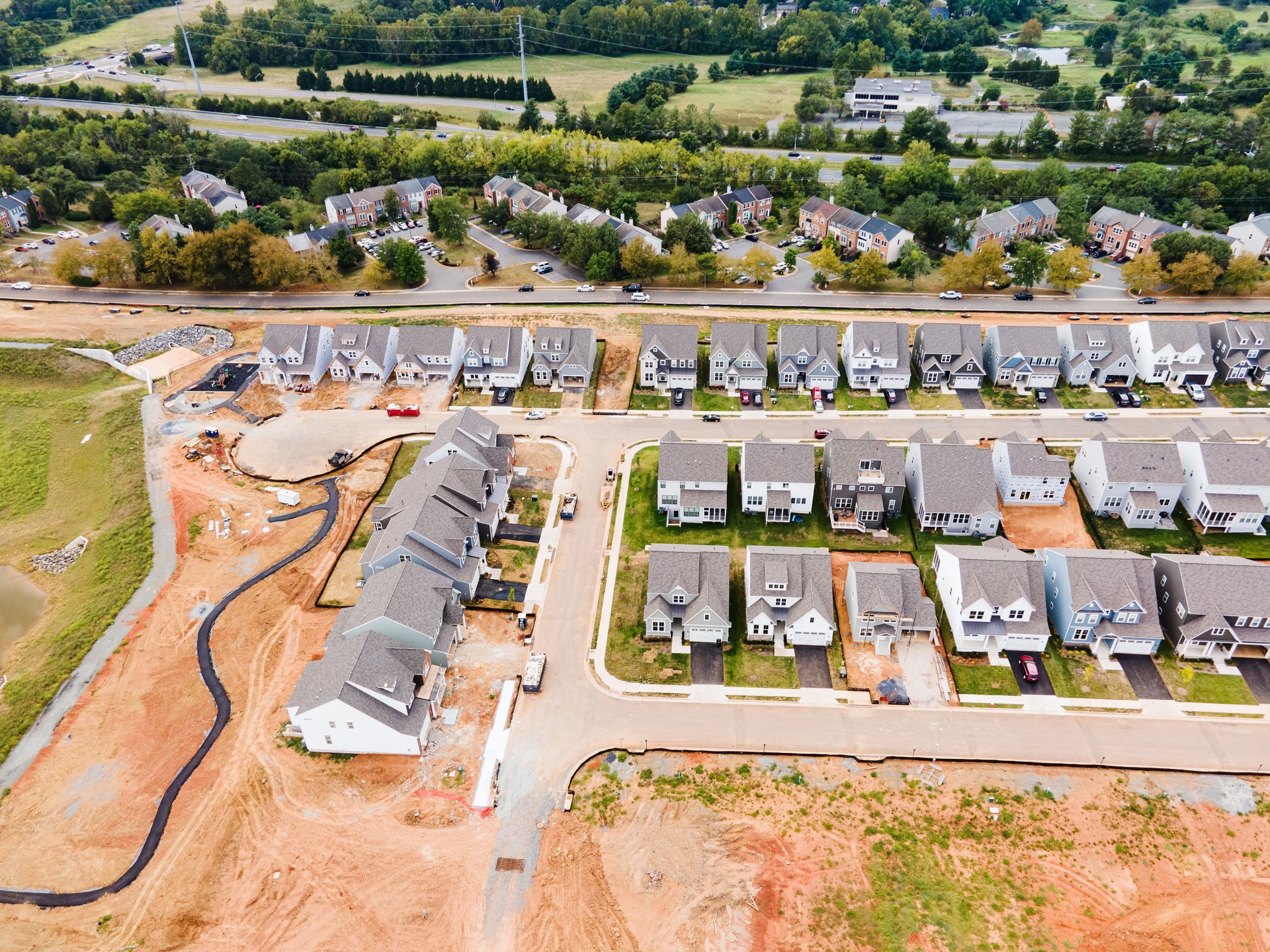 Construction site with new houses and prepared place for construction.